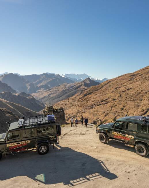 Group with two cars parked at Lighthouse Point on the Skippers Road Queenstown