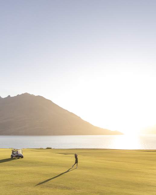 Golfer takes a swing at Jacks Point in summer