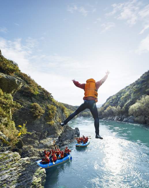 Rafter jumps into water during white water rafting trip