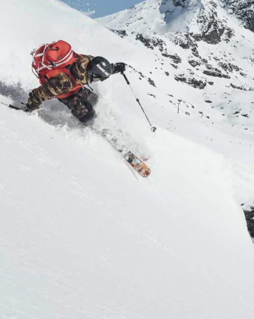Downhill Skier Carving Mountainside