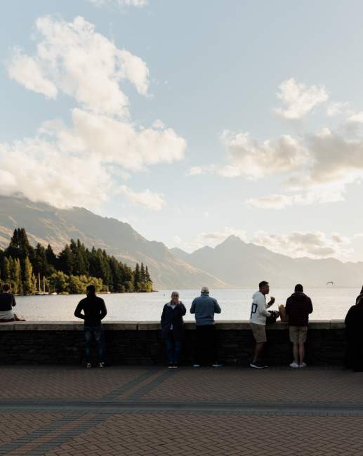 Queenstown Bay at dusk with mountains in the background