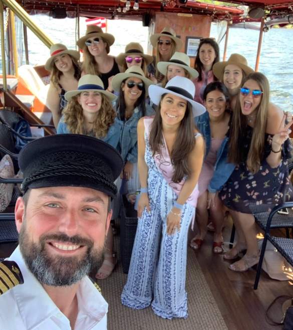 Cruise captain posting with bachelorette party