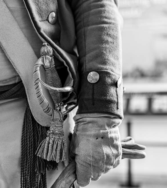 black and white photo of belt and hand of soldier