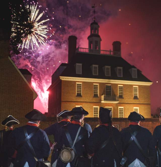 Colonial soldiers watching fireworks go off on the 4th of July