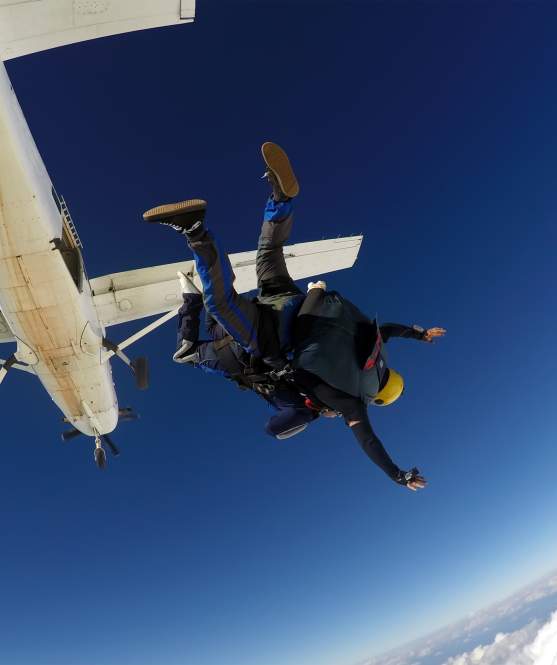 Two skydivers jumping out of a airplane in Perris, CA
