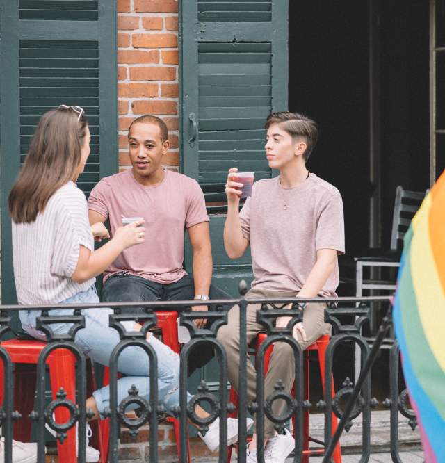 LGBTQ Friends Having Drinks on a French Quarter Balcony