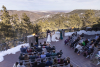 View from above of wedding ceremony on the outdoor patio in winter at Mt Vernon Canyon Club for a wedding ceremony the foothills mountains are in the background