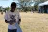 Zimbabwean artist works on a sculpture at Peace River Botanical & Sculpture Gardens