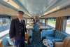 train conductor inside one of the twin sisters train cars at Northern Central Railway