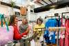 three ladies shopping in a boutique