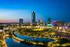 Skyline photo of downtown OKC that captures Scissortail Park at night