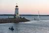 Groups of people sailing and kayaking around the Lake Hefner Lighthouse