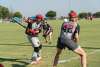 a few men on a baseball field hitting the ball