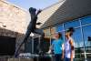 two girls admire the Wilma Rudolph statue