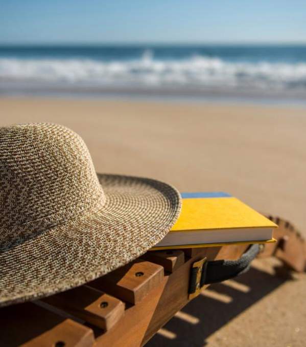 Bethany Beach hat and lounge chair with book