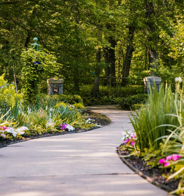 A flower-lined pathway throughout the Overland Park Arboretum & Botanical Gardens