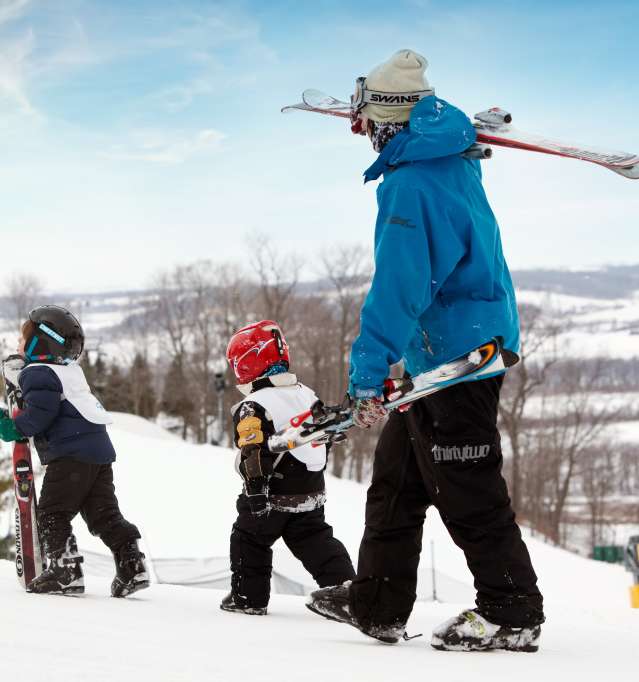 People walking on ski hill in Galena Country during the winter