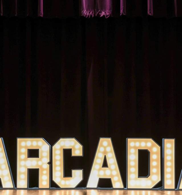 Marquee signage at the stage of the Arcadia Theatre that says "ARCADIA"