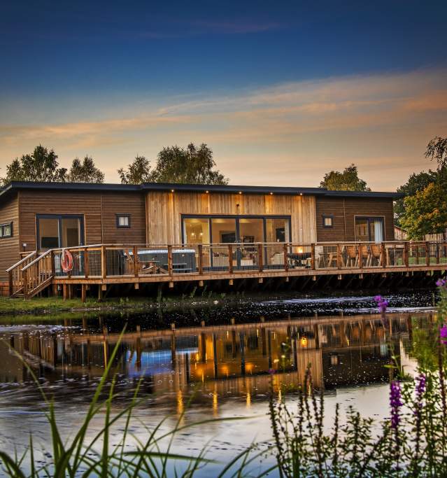 a lodge on the waterfront at night