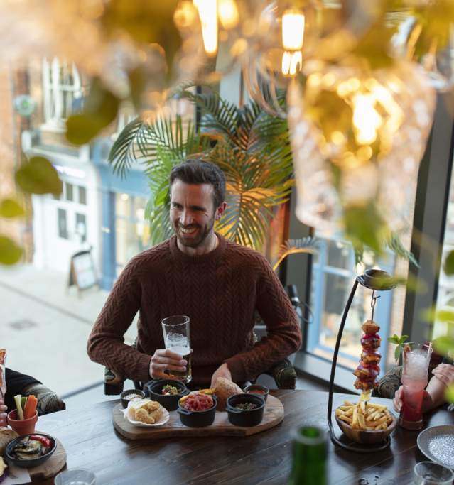 A group of friends enjoying tapas and drinks at the Botanist