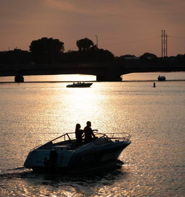 Couple on boat at sunset