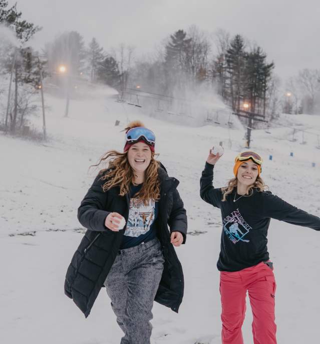 Two Women Playing in Snow