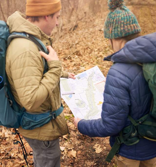 People Looking at Hiking Map