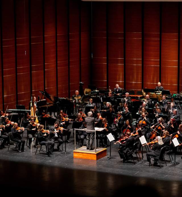 Image the Austin Symphony Orchestra performing on stage.