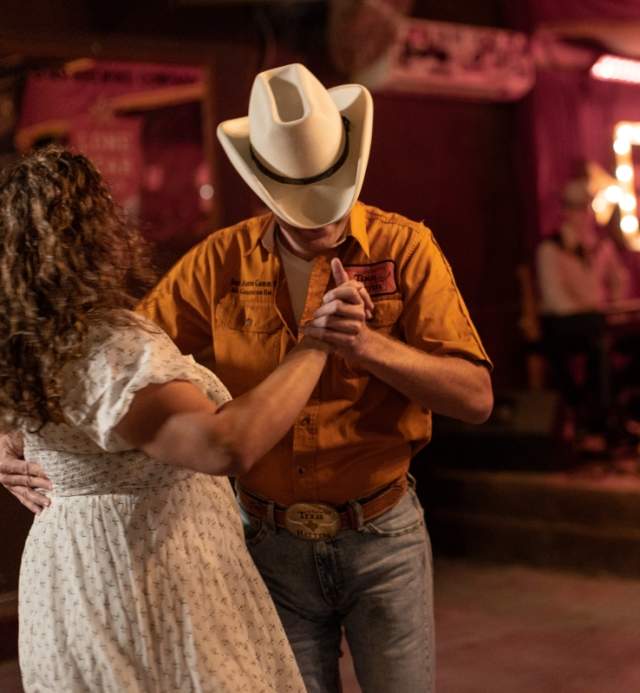 Man and woman two-stepping at White Horse