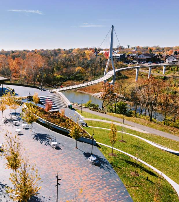Riverside Crossing Park and the Dublin Link pedestrian bridge surrounded by fall color.