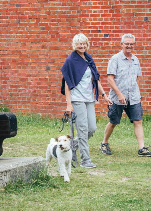 Couple and dog at Hurst Castle in the New Forest