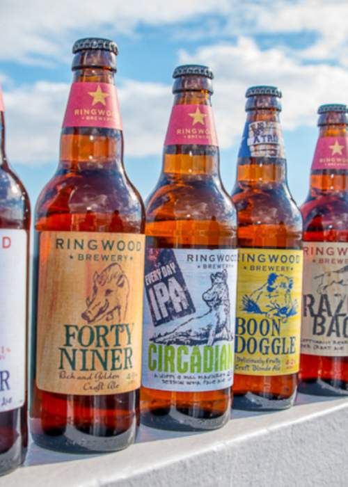 Bottles of Ringwood Brewery by the sea in the New Forest