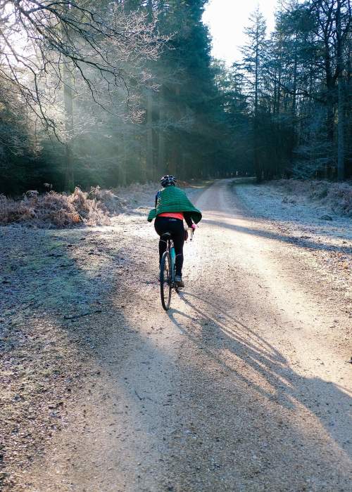 Two people cycling in the frost in the New Forest - Cycling