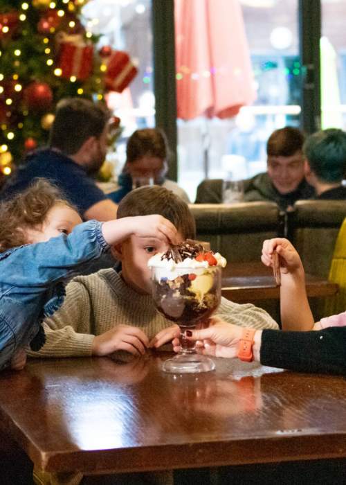 Family dining at Christmas time at Sandy Balls Holiday Village in the New Forest