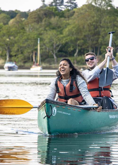 Two people canoeing on Beaulieu River with New Forest Activities - Things to Do Feature