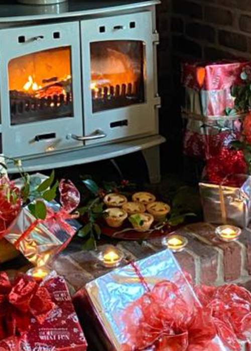 Presents and gifts by the fireplace at self catering cottage in the New Forest