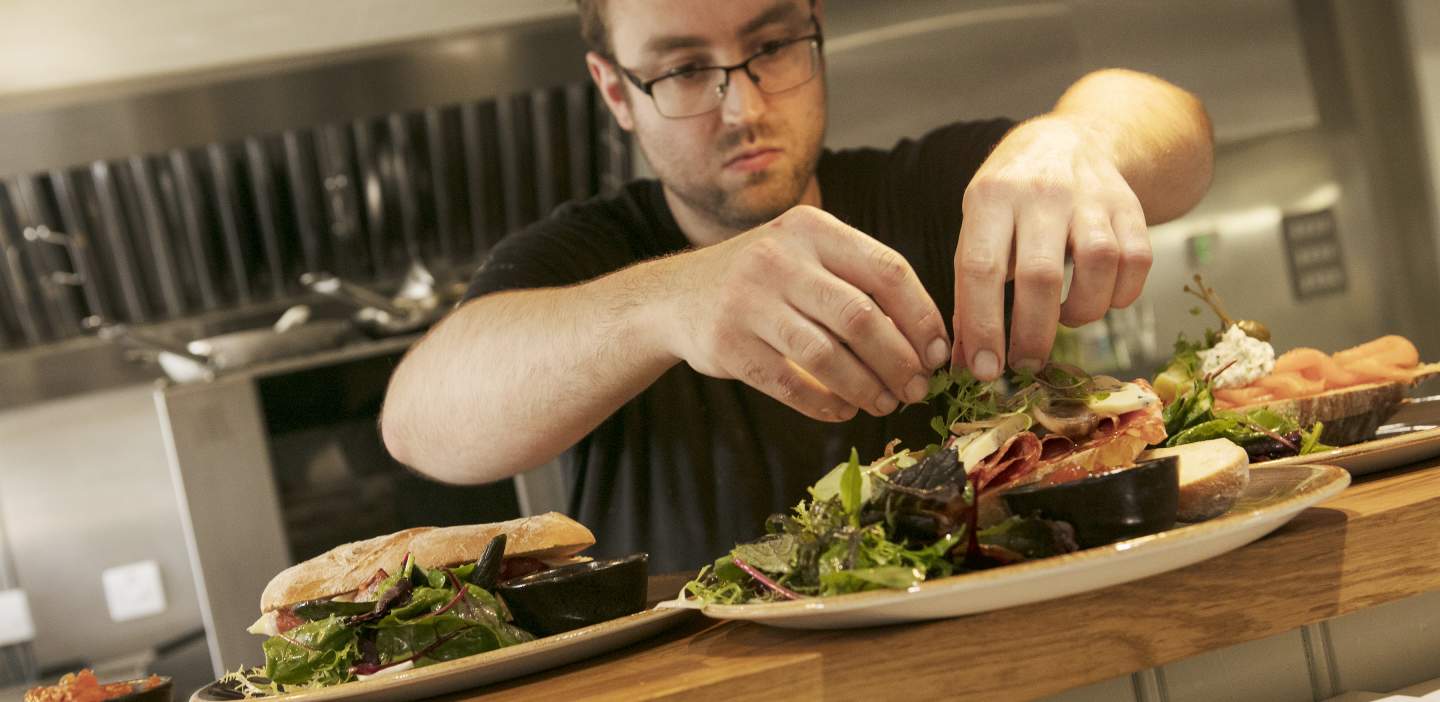 An image of food being prepared in a restaurant in Helmsley