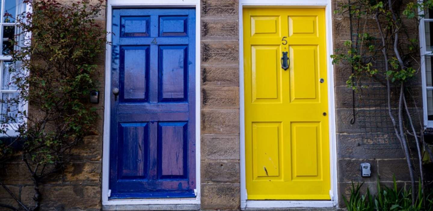 An image of two doors painted blue and yellow