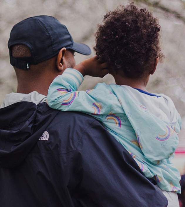 Dad holding a girl