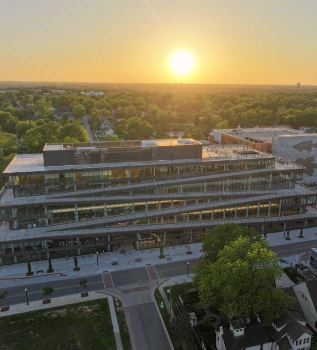 An aerial view of Ledger with the sun setting in the distance.