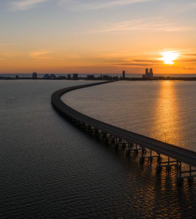 Sunrise over the island in the early morning. View over the causeway