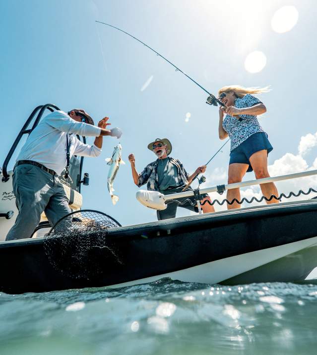 Couple fishing and catching a fish