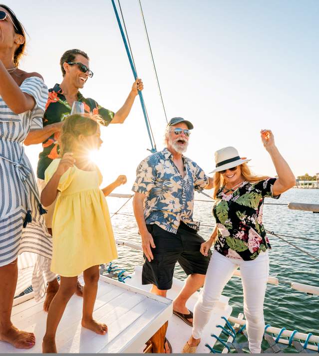A family celebrating and partying on a boat on off the bay shore on South Padre Island
