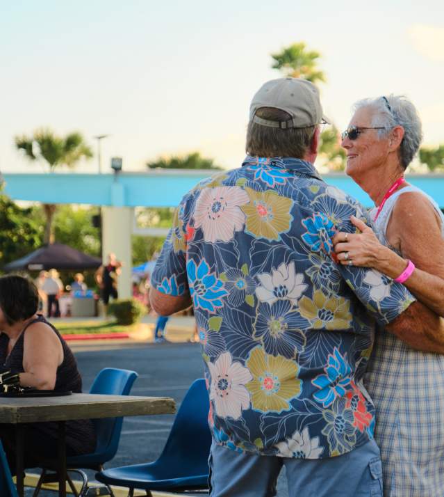 Older couple dancing to live music