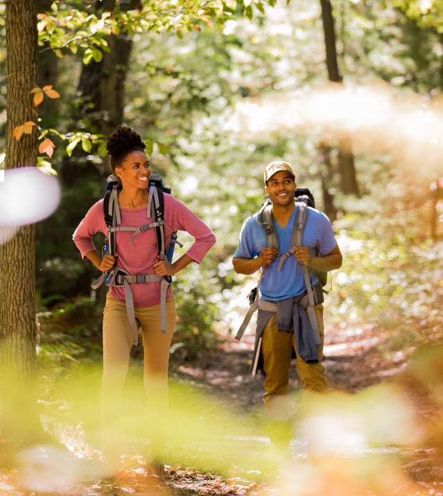 Couple with backpacks hiking the Appalachian Trail