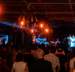 JaRon Marshall  performs with band on stage while crowd watches in the foreground