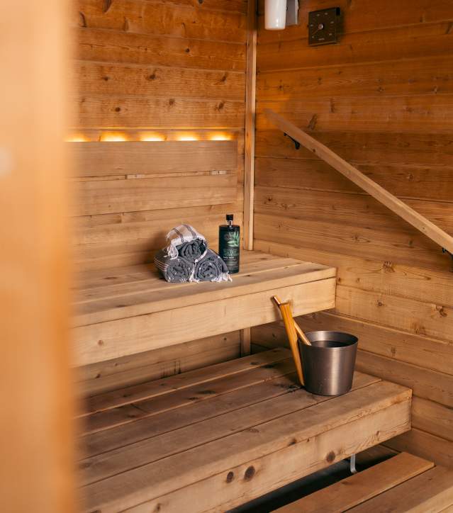 the wooden interior of a traditional finnish sauna