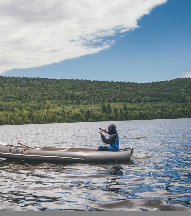 Boy sitting in canoe in the lake