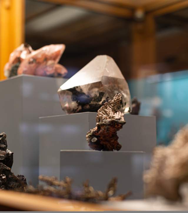 Precious gemstones in a glass case at the A.E. Seaman Mineral Museum in Houghton