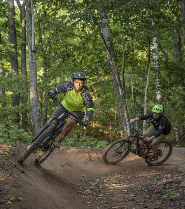 Two mountain bikers riding in Copper Harbor.